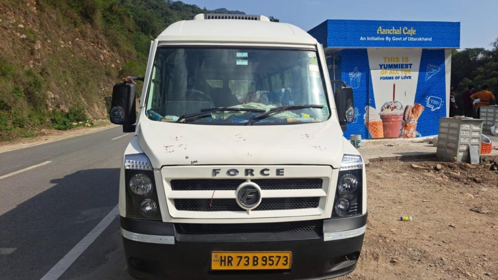 White Force Tempo Traveller front view parked on a mountain road